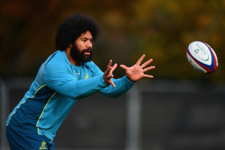 TATAFU POLOTA-NAU of Australia receives a pass during a training session at the Lensbury Hotel in London, England. TATAFU POLOTA-NAU of Australia receives a pass during a training session at the Lensbury Hotel in London, England.