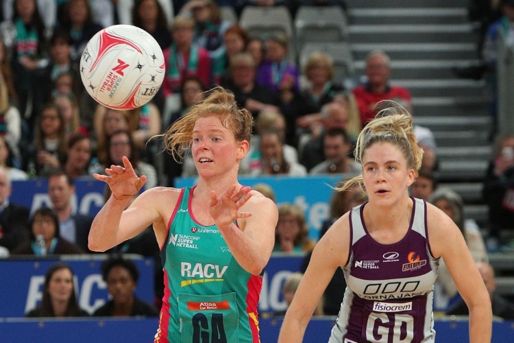 TEGAN PHILIP of the Vixens (L) passes during the Super Netball match between the Vixens and the Firebirds at Hisense Arena in Melbourne, Australia.