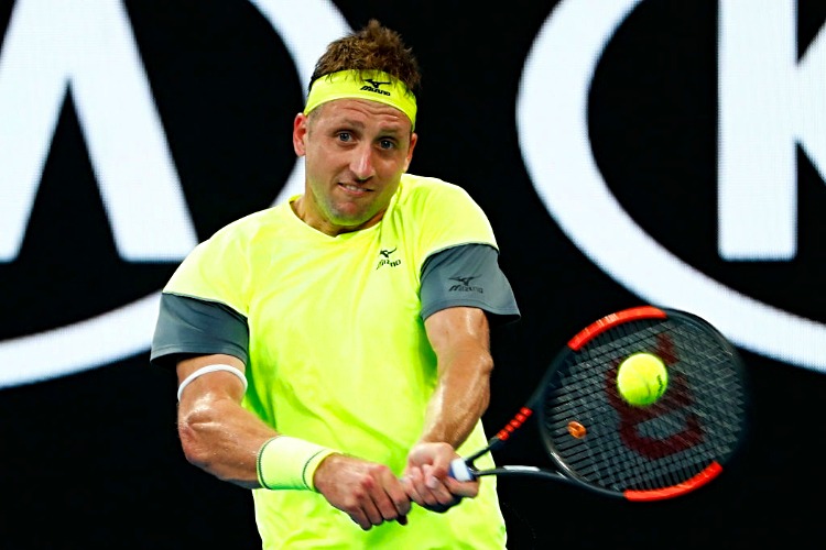TENNYS SANDGREN of the United States plays a backhand against Dominic Thiem of Austria of the 2018 Australian Open at Melbourne Park in Australia.