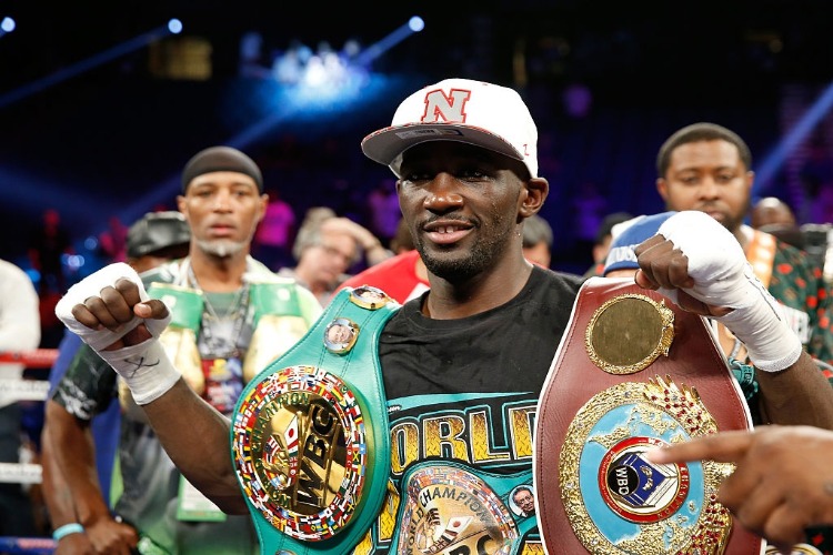 WBO junior welterweight champion TERENCE CRAWFORD poses with belts after his unanimous decision victory over WBC champion Viktor Postol of Ukraine at MGM Grand Garden Arena in Las Vegas, Nevada. WBO junior welterweight champion TERENCE CRAWFORD poses with belts after his unanimous decision victory over WBC champion Viktor Postol of Ukraine at MGM Grand Garden Arena in Las Vegas, Nevada.