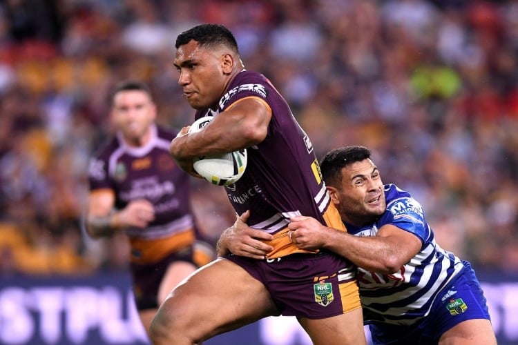 TEVITA PANGAI of the Broncos breaks away from the defence during the NRL match between the Brisbane Broncos and the Canterbury Bulldogs at Suncorp Stadium in Brisbane, Australia.