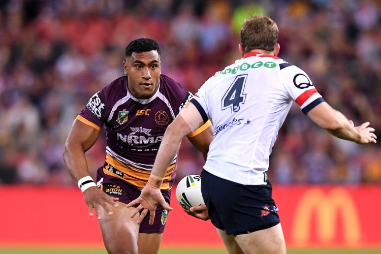 TEVITA PANGAI of the Broncos takes on the defence during the NRL match between the Brisbane Broncos and the Sydney Roosters at Suncorp Stadium in Brisbane, Australia.