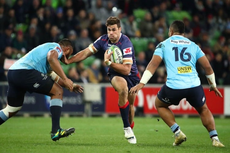 TOM ENGLISH of the Rebels runs with the ball during the Super Rugby match between the Rebels and the Waratahs at AAMI Park in Melbourne, Australia.