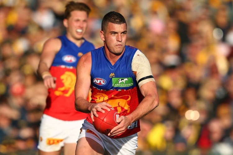 TOM ROCKLIFF of the Lions looks to pass the ball during the AFL match between the West Coast Eagles and the Brisbane Lions at Domain Stadium in Perth, Australia.