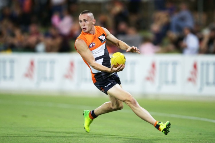 TOM SCULLY of the Giants looks upfield during the JLT Community Series AFL match between the Greater Western Sydney Giants and the North Melbourne Kangaroos at UNSW Canberra Oval in Canberra, Australia.