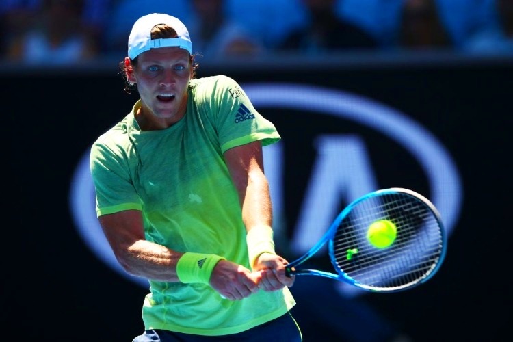 TOMAS BERDYCH of the Czech Republic plays a backhand against Fabio Fognini of Italy of the 2018 Australian Open at Melbourne Park in Australia.