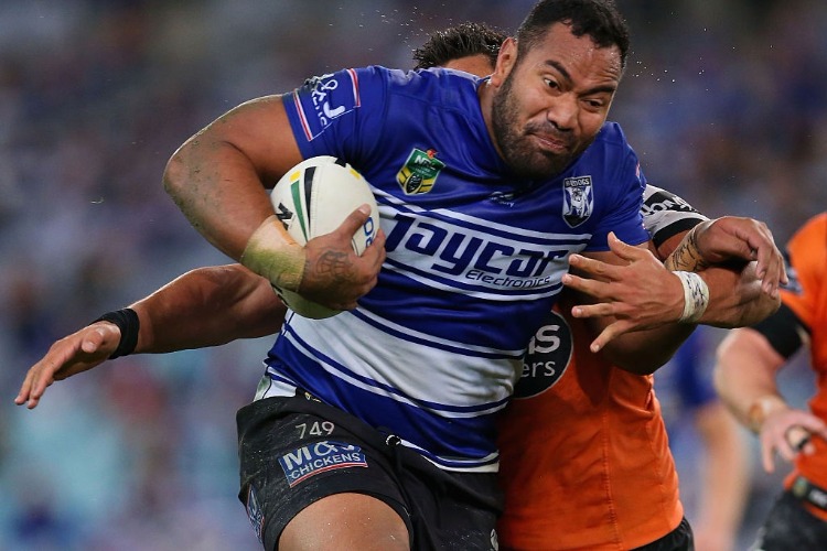 TONY WILLIAMS of the Bulldogs is tackled during the NRL match between the Canterbury Bulldogs and the Wests Tigers at ANZ Stadium in Sydney, Australia.
