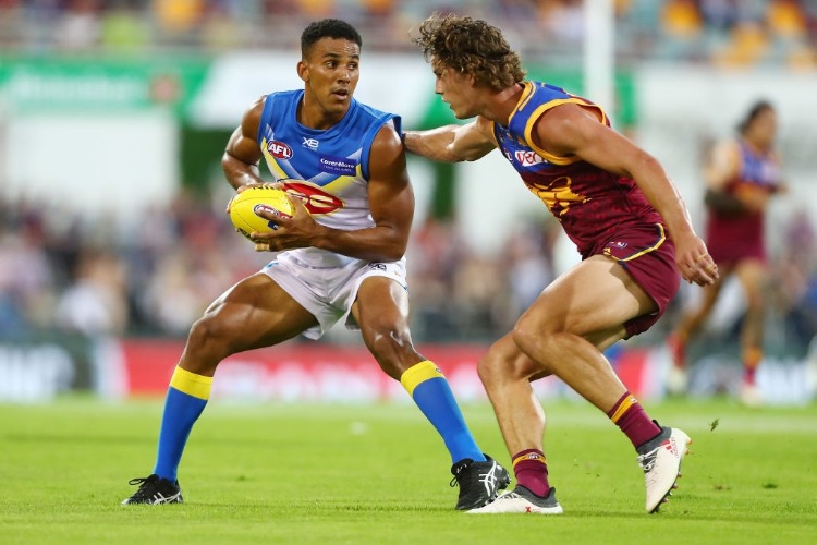 TOUK MILLER of the Suns runs the ball during the AFL match between the Brisbane Lions and the Gold Coast Suns at The Gabba on April 22, 2018 in Brisbane, Australia.