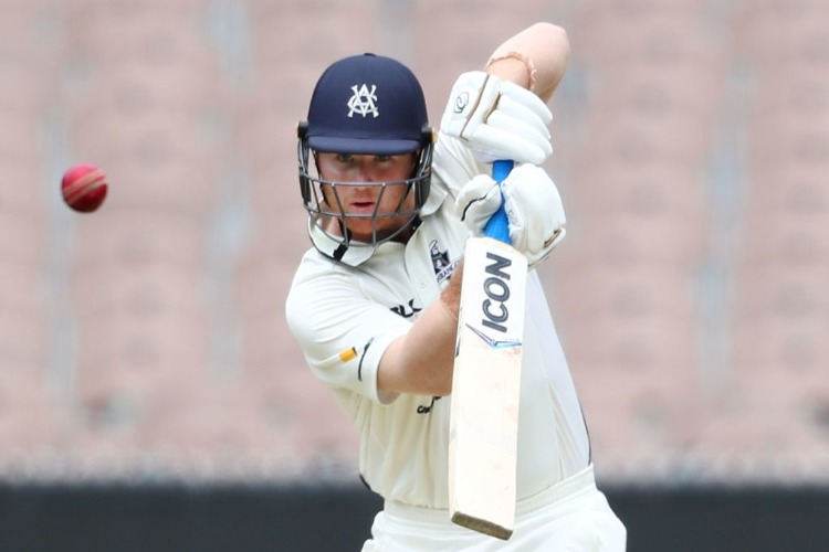 TRAVIS DEAN of Victoria bats during the Sheffield Shield match between Victoria and South Australia at the MCG in Melbourne, Australia.