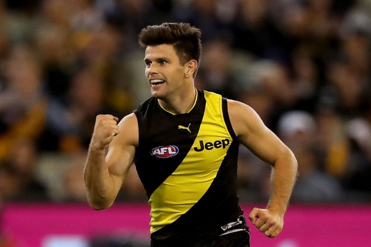 TRENT COTCHIN of the Tigers celebrates after scoring a goal during the AFL match between the Richmond Tigers and the Collingwood Magpies at MCG in Melbourne, Australia.