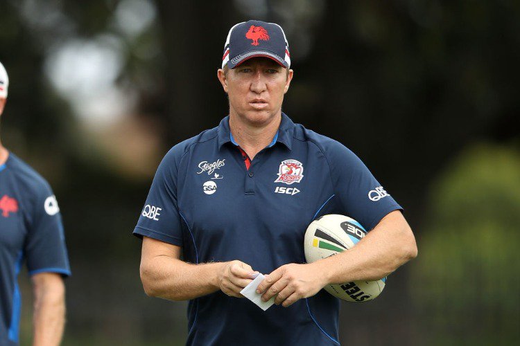 Roosters coach TRENT ROBINSON watches on during the Sydney Roosters NRL training session at Kippax Lake in Sydney, Australia.