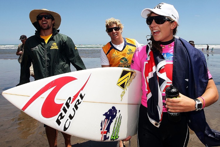 TYLER WRIGHT of Australia celebrates after winning gold in the Girls Under 18 division final during the Quiksilver ISA World Junior Surfing Championships at Piha Beach in Auckland, New Zealand.