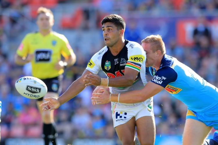 TYRONE PEACHEY of the Panthers offloads the ball during the NRL match between the Penrith Panthers and the Gold Coast Titans in Penrith, Australia.