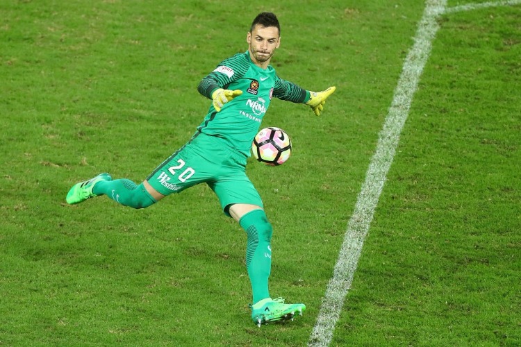 VEDRAN JANJETOVIC of the Wanderers kicks during the A-League Elimination Final match between the Brisbane Roar and the Western Sydney Wanderers at Suncorp Stadium in Brisbane, Australia.