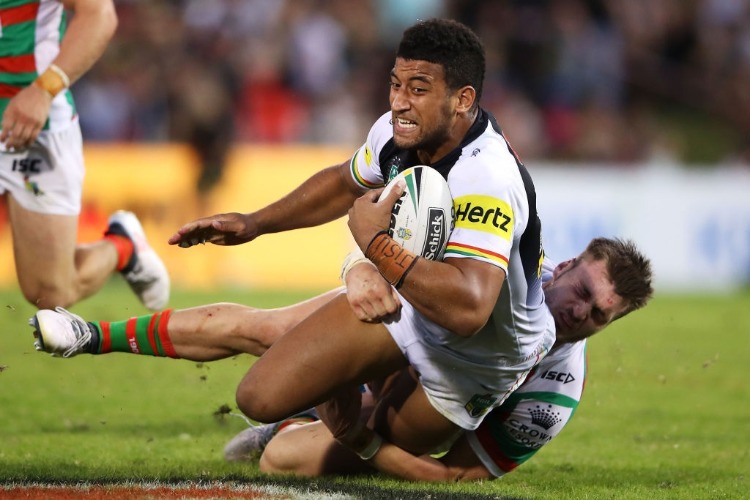 VILIAME KIKAU of the Panthers is tackled during the NRL match between the Penrith Panthers and the South Sydney Rabbitohs at Penrith Stadium in Sydney, Australia.