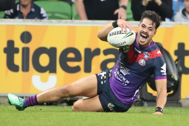 YOUNG TONUMAIPEA of the Melbourne Storm scores a try during the NRL match between the Melbourne Storm and New Zealand Warriors at AAMI Park in Melbourne, Australia.