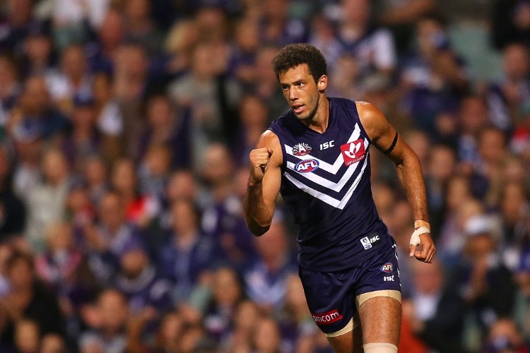 ZAC CLARKE of the Dockers celebrates after a goal during the AFL match between the Fremantle Dockers and the Sydney Swans at Domain Stadium in Perth, Australia.