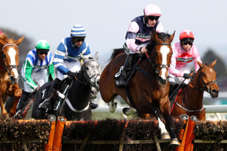 THE BIG BITE running in the Mersey Novices Hurdle during Grand National Day at Aintree in Liverpool, England.