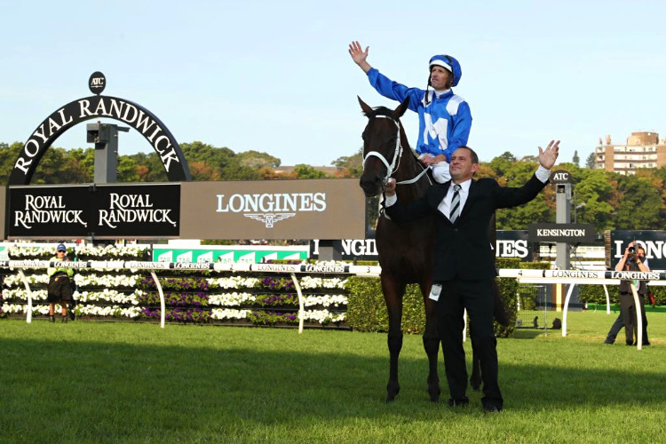 Jockey Hugh Bowman, trainer Chris Waller and Winx pose after winning the Longines Queen Elizabeth Stakes at Royal Randwick in Sydney, Australia.