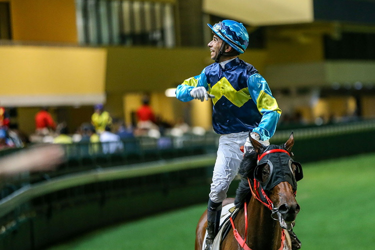 Joao Moreira celebrates True Grit's win in the last.