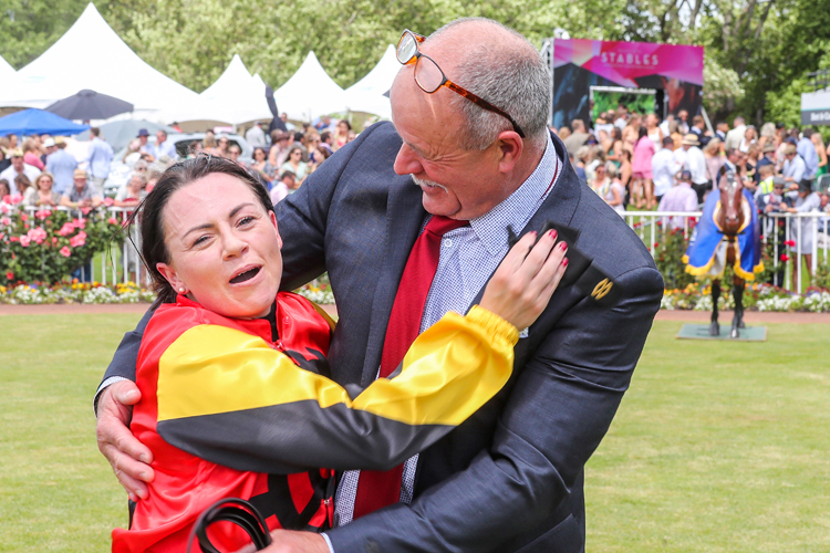 Jockey Samantha Wynne celebrates with La Romanee’s part-owner, John Miller