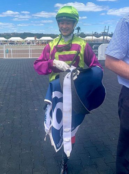 A beaming Simon Kok unsaddles after his first Tasmania winner.