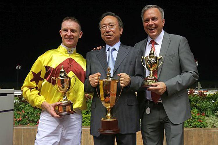 The Hong Kong team could not wipe the smiles off their faces: (from left) jockey Zac Purton, owner Mr Boniface Ho and trainer Caspar Fownes.