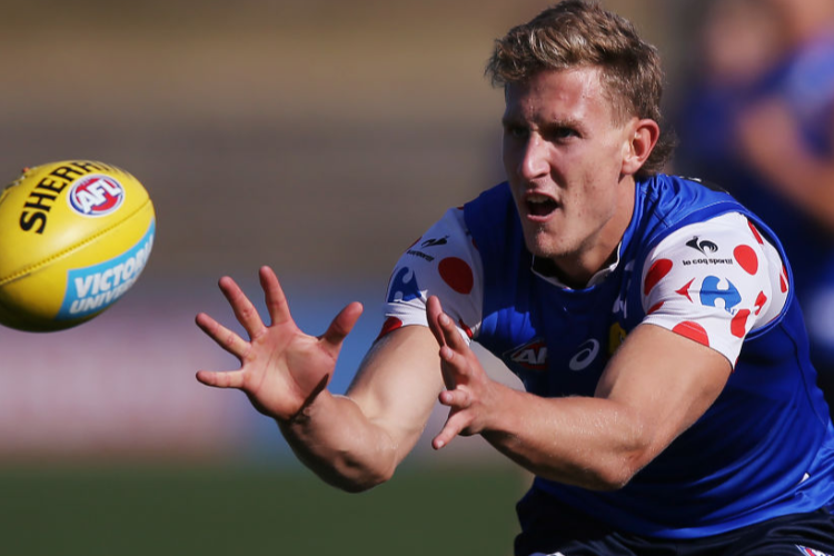 AARON NAUGHTON of the Bulldogs marks the ball during a Western Bulldogs AFL training session at Whitten Oval in Melbourne, Australia.