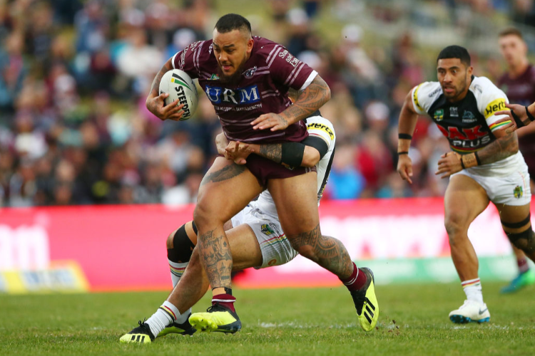 ADDIN FONUA-BLAKE of the Sea Eagles is tackled during the NRL match between the Manly Sea Eagles and the Penrith Panthers at Lottoland in Sydney, Australia.