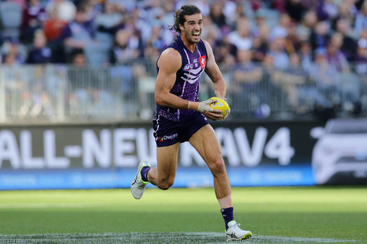 ALEX PEARCE of the Dockers looks to pass the ball during the AFL match between the Fremantle Dockers and the Brisbane Lions at Optus Stadium in Perth, Australia.
