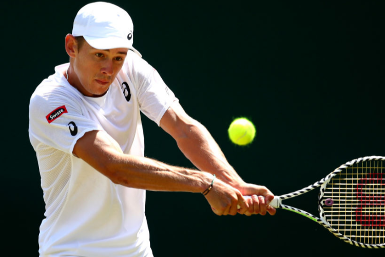 ALEX DE MINAUR of Australia plays a backhand during The Wimbledon at All England Lawn Tennis and Croquet Club in London, England.