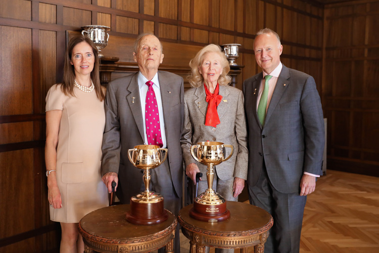 Annabel Myer, Baillieu Myer AC, Sarah Myer and Rupert Myer with the 1919 and 2019 Melbourne Cup trophies