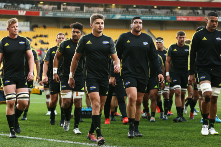 BEAUDEN BARRETT of the Hurricanes leads his team off the field after warming up during the Super Rugby match between the Hurricanes and Rebels at Westpac Stadium in Wellington, New Zealand.