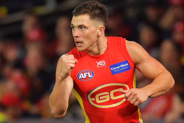 BEN AINSWORTH of the Suns celebrates after kicking a goal during the AFL match between the Adelaide Crows and Gold Coast Suns at Adelaide Oval in Adelaide, Australia.