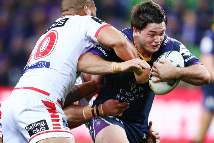 BRANDON SMITH of the Storm runs with the ball from Leeson Ah Mau of the Dragons during the NRL match between the Melbourne Storm and the St George Illawarra Dragons at AAMI Park in Melbourne, Australia.