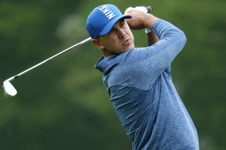 BROOKS KOEPKA of the United States plays his second shot during the PGA Championship at the Bethpage Black course in Farmingdale, New York.