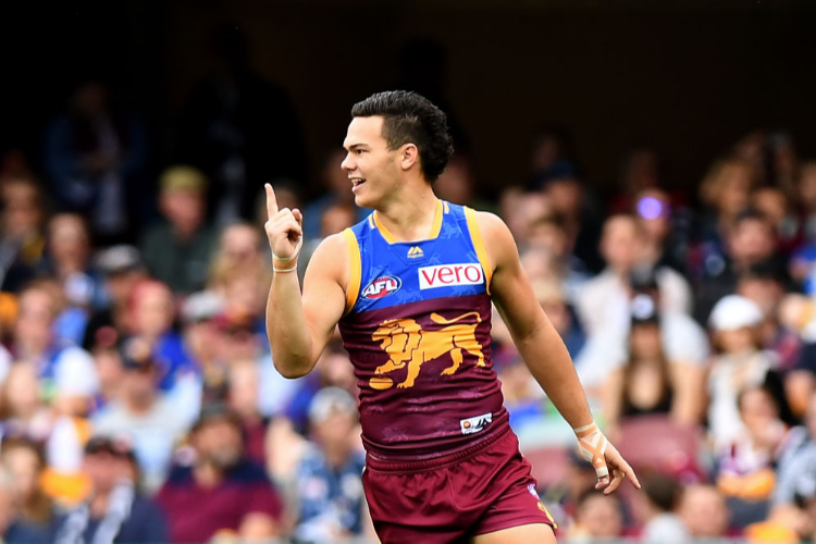 CAMERON RAYNER of the Lions celebrates kicking a goal during the AFL match between the Brisbane Lions and the Carlton Blues at The Gabba in Brisbane, Australia.