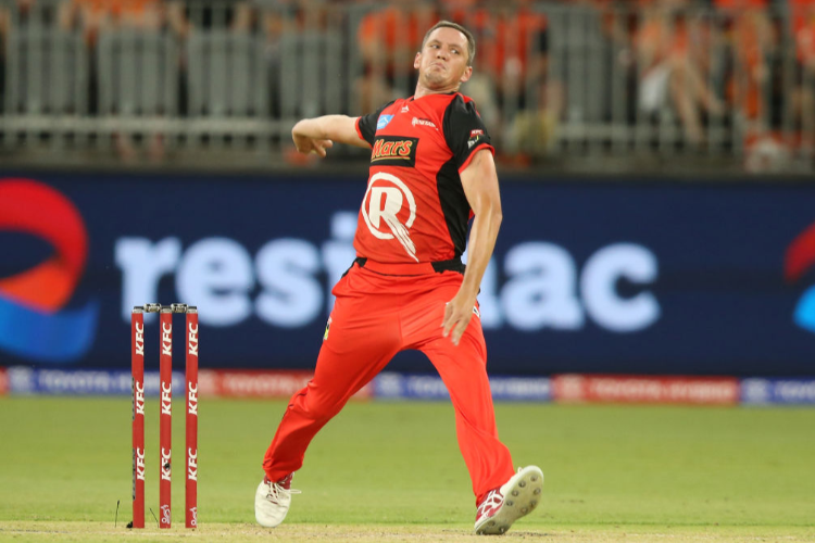 CHRIS TREMAIN of the Renegades bowls during the Big Bash League match between the Perth Scorchers and the Melbourne Renegades at Optus Stadium in Perth, Australia.