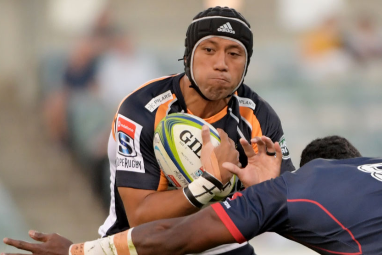 CHRISTIAN LEALIIFANO of the Brumbies is tackled during the Super Rugby match between the Brumbies and the Rebels at GIO Stadium in Canberra, Australia.