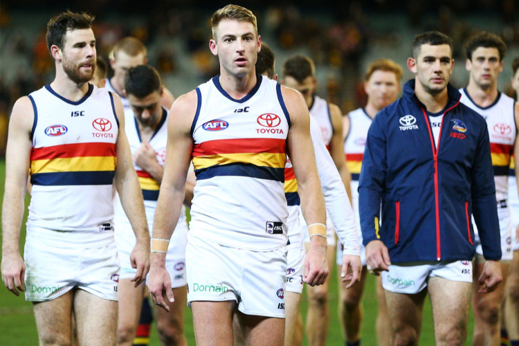 Adelaide Crows teammates during an AFL match.