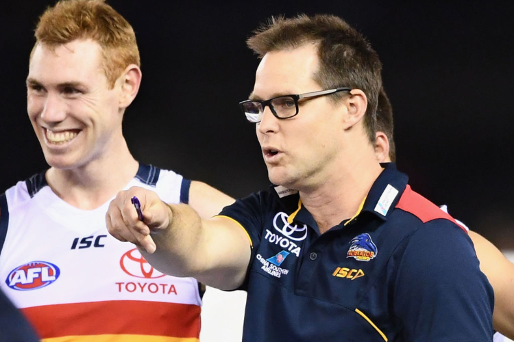 DAVID TEAGUE the assistant coach of the Crows talks to his players during the AFL match between the Essendon Bombers and the Adelaide Crows at Etihad Stadium in Melbourne, Australia.