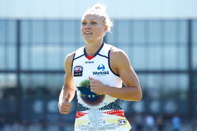 ERIN PHILLIPS of the Crows runs to the coin toss during the NAB AFLW match between the Carlton Blues and the Adelaide Crows at Ikon Park in Melbourne, Australia. ERIN PHILLIPS of the Crows runs to the coin toss during the NAB AFLW match between the Carlton Blues and the Adelaide Crows at Ikon Park in Melbourne, Australia.