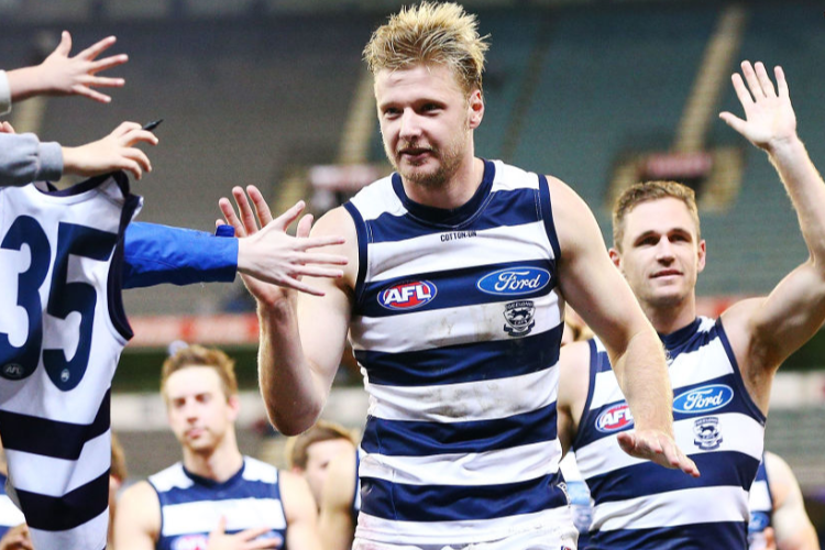 JOEL SELWOOD of the Cats and GEORGE HORLIN-SMITH of the Cats celebrates the win during the AFL match between the Collingwood Magpies and the Geelong Cats at MCG in Melbourne, Australia.