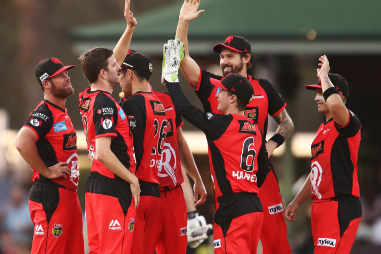 HARRY GURNEY of the Renegades celebrates with team mates during the Big Bash League match between the Sydney Sixers and the Melbourne Renegades at SCG in Sydney, Australia.