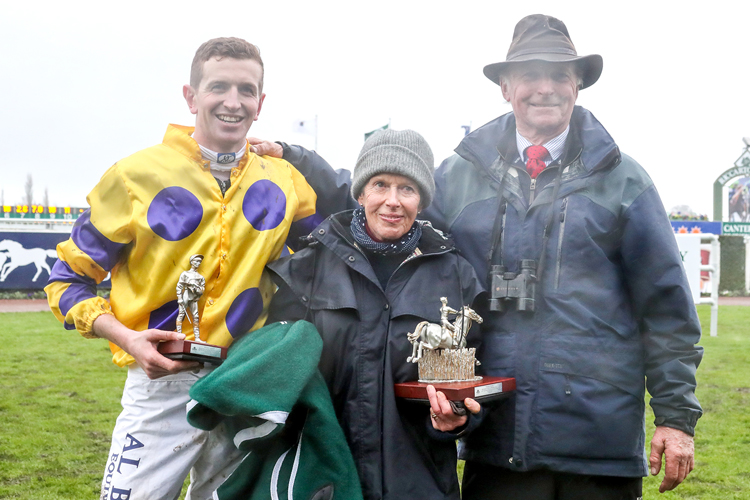 Shaun Phelan with Anne and Harvey Wilson as they pose with the winning trophy.