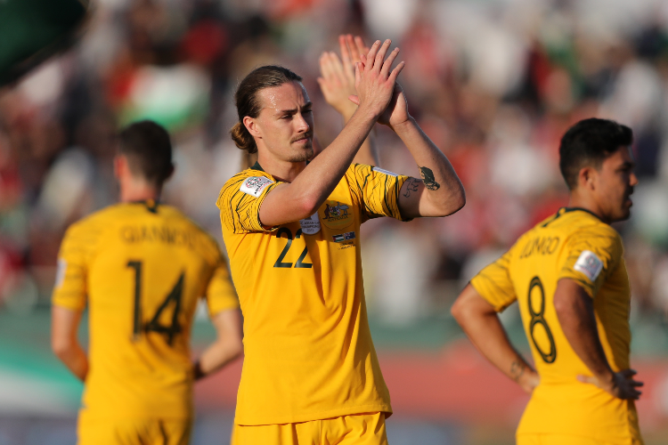 JACKSON IRVINE of Australia and his team mates celebrate following their sides victory between Palestine and Australia at Rashid Stadium in Dubai, United Arab Emirates.