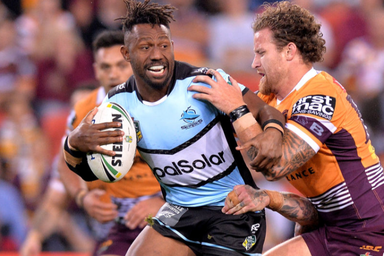 JAMES SEGEYARO of the Sharks attempts to break through the defence during the NRL match between the Brisbane Broncos and the Cronulla Sharks at Suncorp Stadium in Brisbane, Australia.