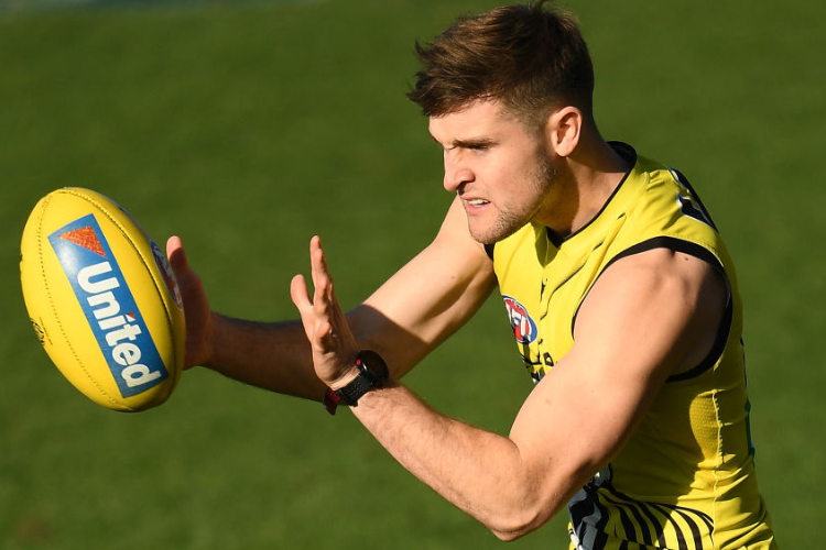 JAYDEN SHORT of the Tigers marks during a Richmond Tigers AFL training session at Punt Road Oval in Melbourne, Australia.