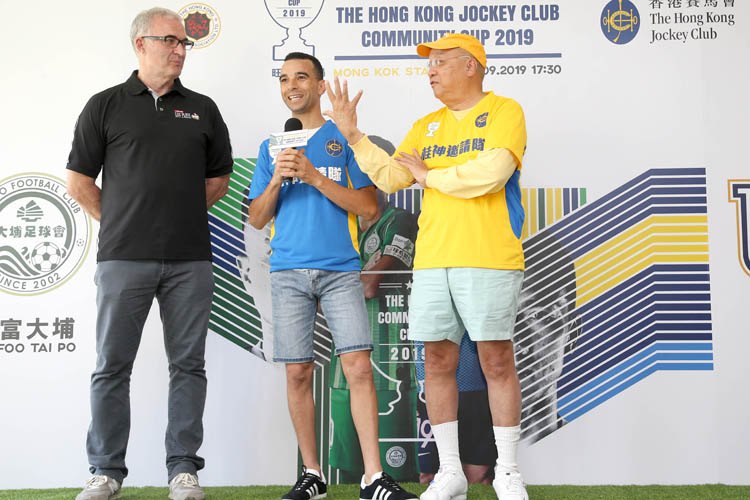 Renowned jockey Joao Moreira and football commentator Peter Wong (right) discuss the resumed exhibition match between intermingled teams of top jockeys and local football legends.