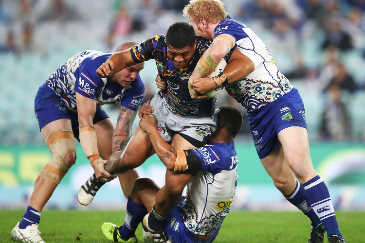 JOHN ASIATA of the Cowboys is tackled by the Bulldogs defence during the NRL match between the Canterbury Bulldogs and the North Queensland Cowboys at ANZ Stadium in Sydney, Australia.